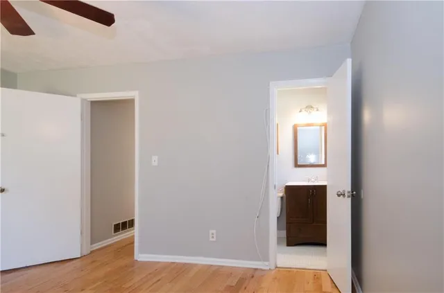 a white toilet sitting next to a bathroom sink