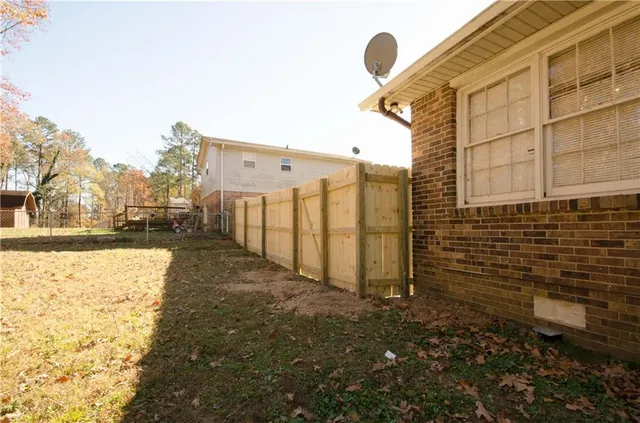 a view of a backyard of the house