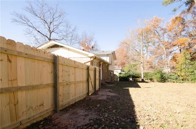 a view of a backyard of the house