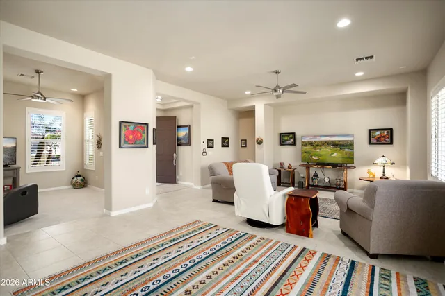 a kitchen with a table chairs refrigerator and cabinets