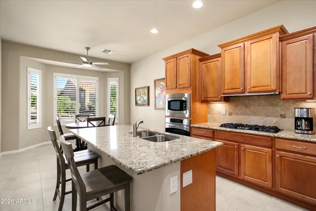 a kitchen with a stove and a window