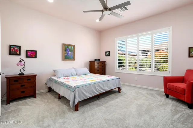 a bathroom with a tub a sink and mirror