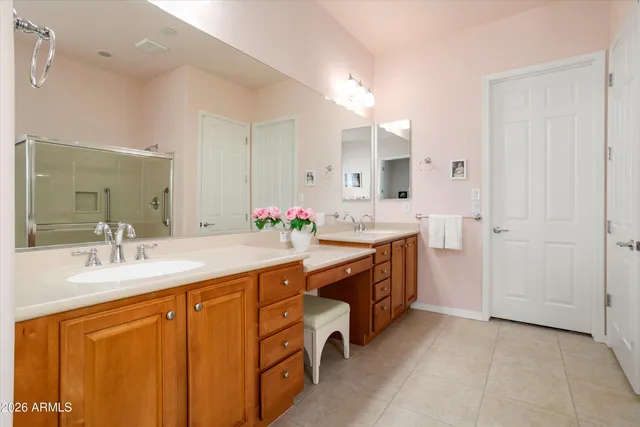 a spacious bedroom with a bed and a window