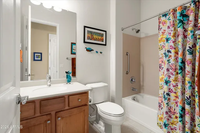 a kitchen with white cabinets and refrigerator
