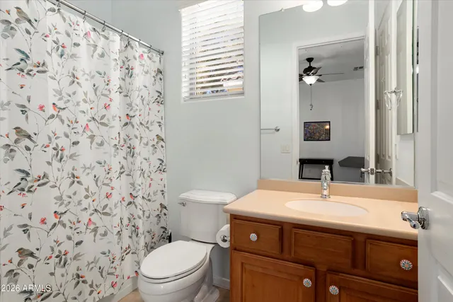 a swimming pool with outdoor seating and plants