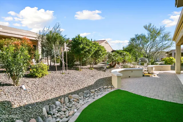 a view of swimming pool with a patio