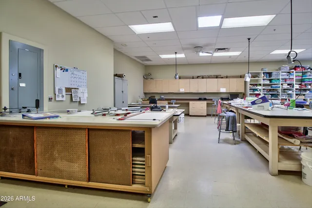 a view of swimming pool with outdoor seating and lake view