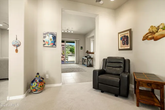 a living room with furniture and a large window