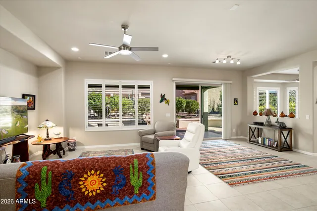 a living room with furniture rug and window