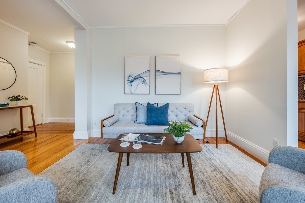 3 Crawford Street, Unit 9 Cambridge, MA 02139 - Photo 6 of 23 a living room with furniture and wooden floor