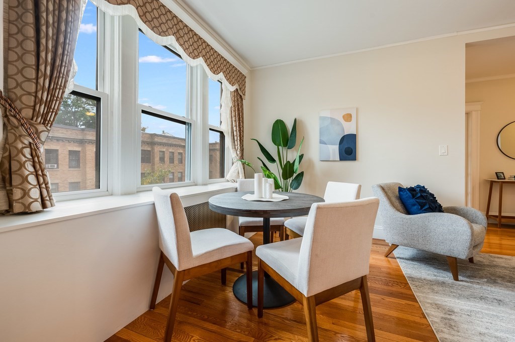 3 Crawford Street, Unit 9 Cambridge, MA 02139 - Photo 10 of 23 a dining room with furniture and wooden floor