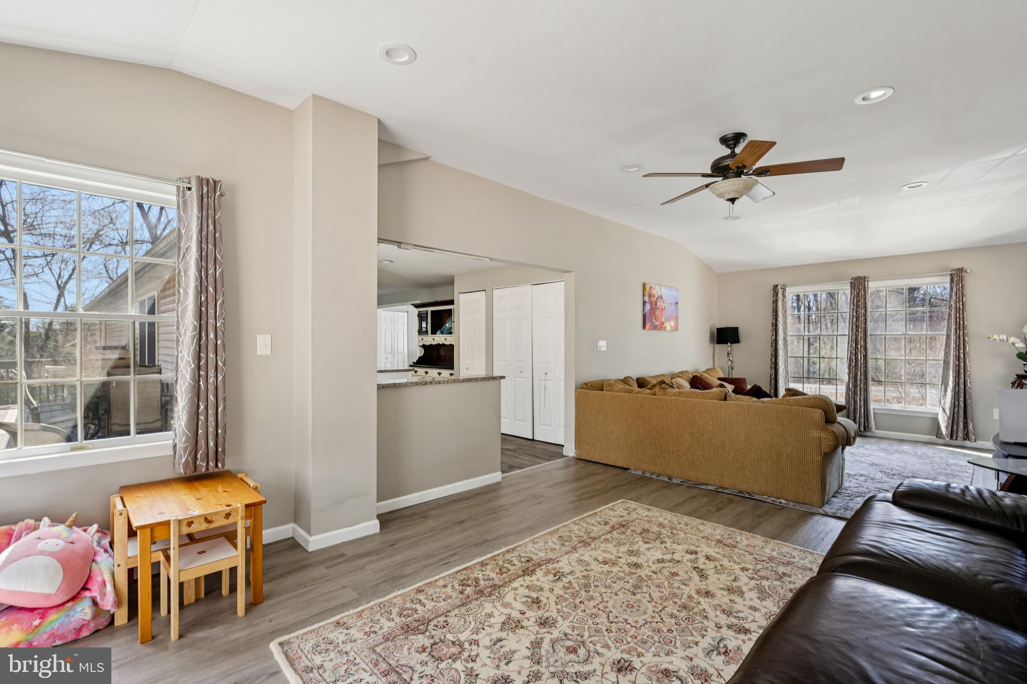 78 Rising Sun Tavern Road Millstone Township, NJ 08510 - Photo 11 of 55 a living room with furniture and wooden floor