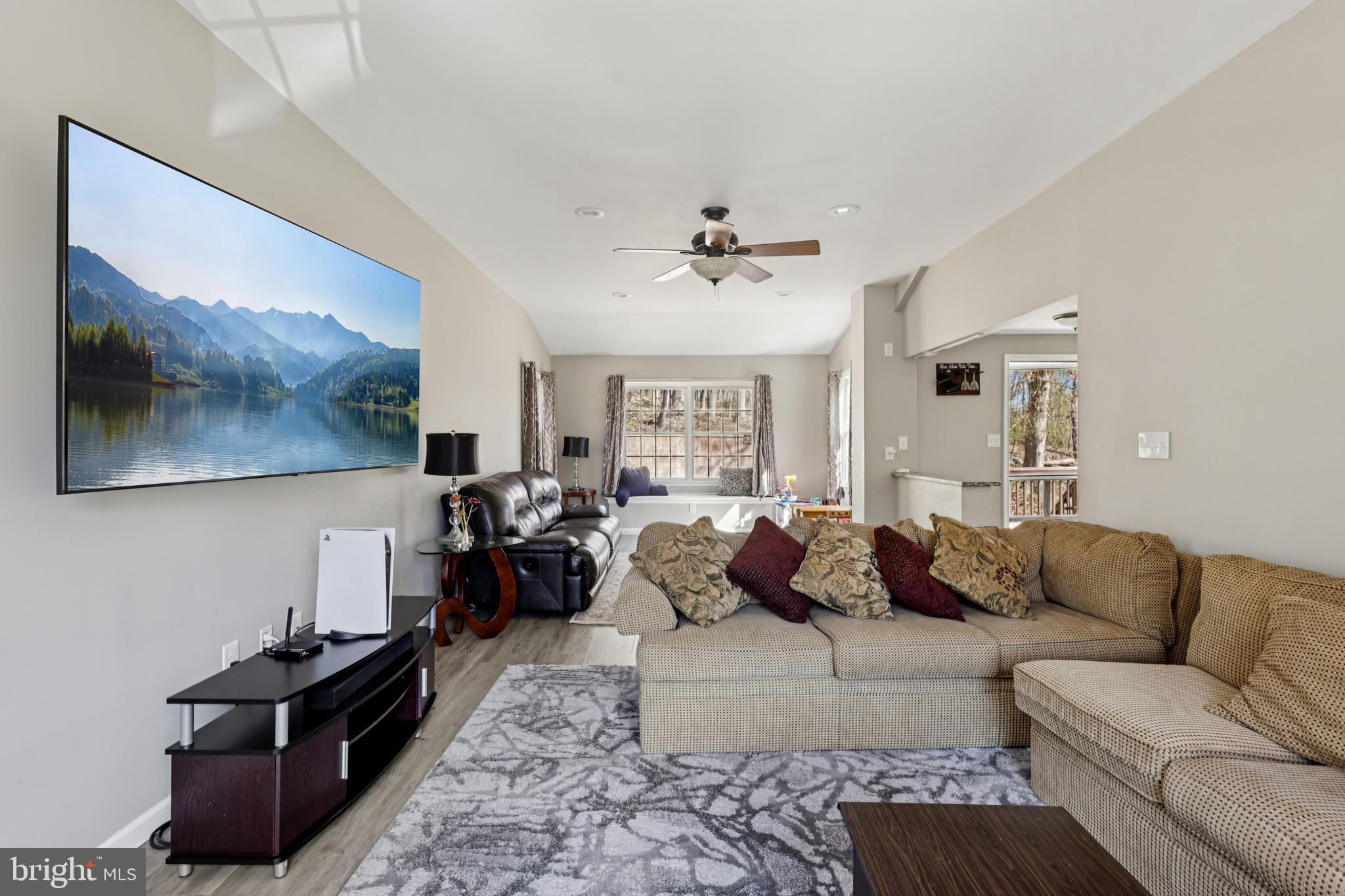 78 Rising Sun Tavern Road Millstone Township, NJ 08510 - Photo 12 of 55 a living room with furniture and wooden floor