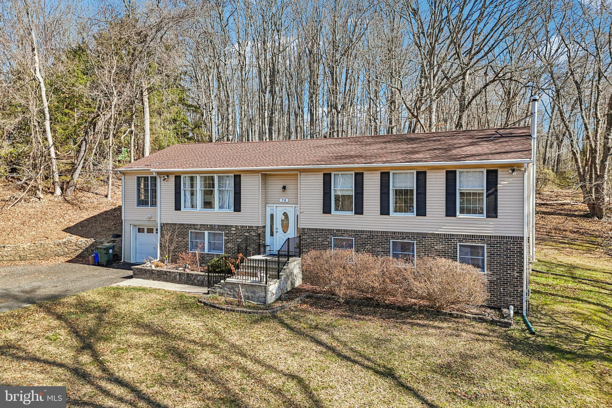 78 Rising Sun Tavern Road Millstone Township, NJ 08510 - Photo 2 of 55 a front view of a house with a yard