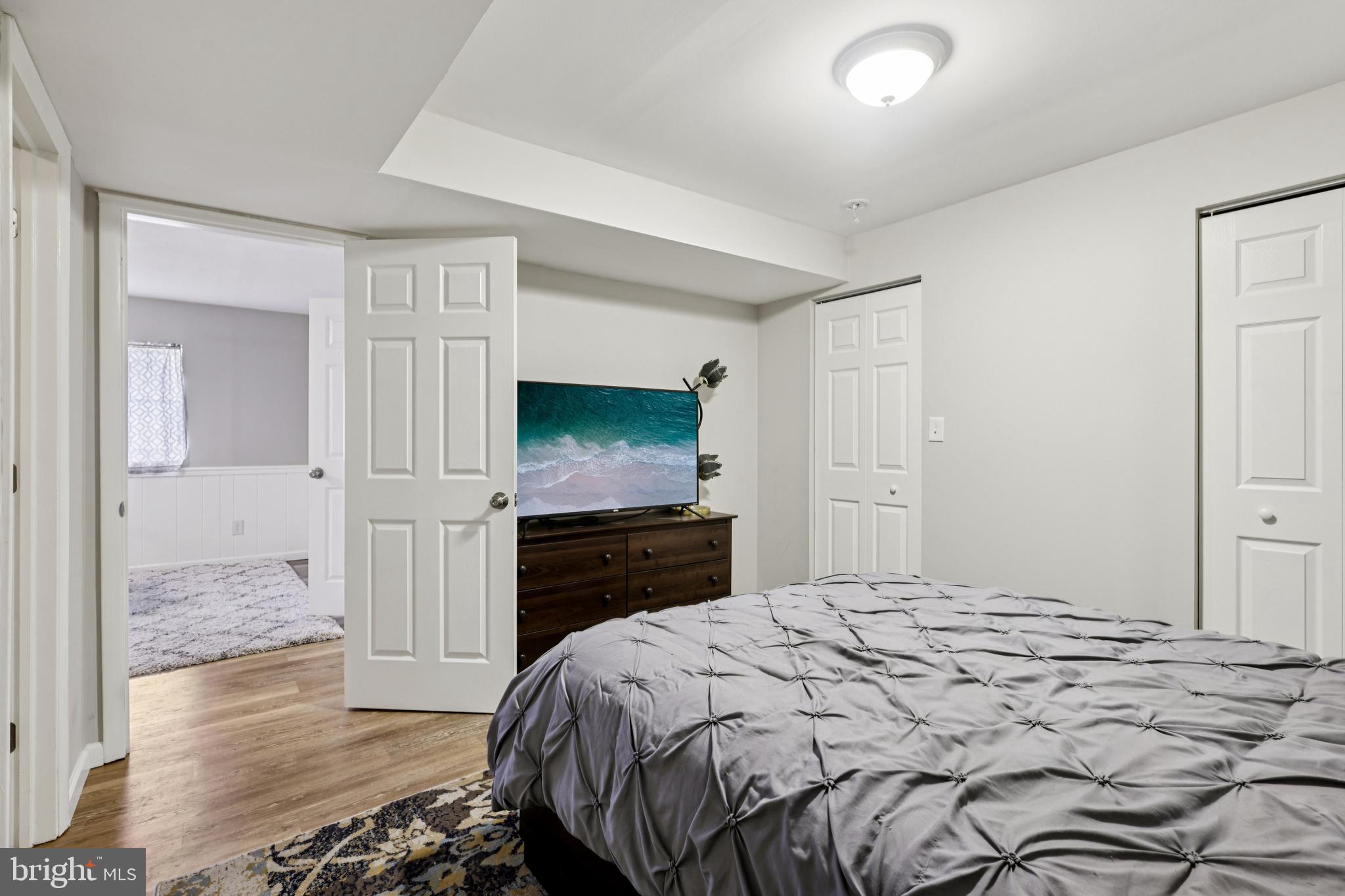 78 Rising Sun Tavern Road Millstone Township, NJ 08510 - Photo 29 of 55 a bedroom with a bed and a flat screen tv