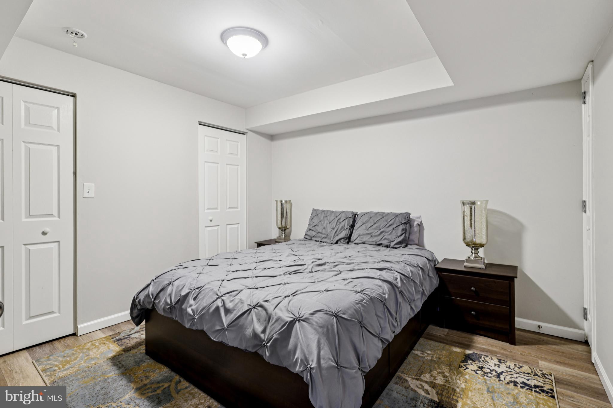 78 Rising Sun Tavern Road Millstone Township, NJ 08510 - Photo 30 of 55 a bedroom with a bed and a lamp with the view of bedroom