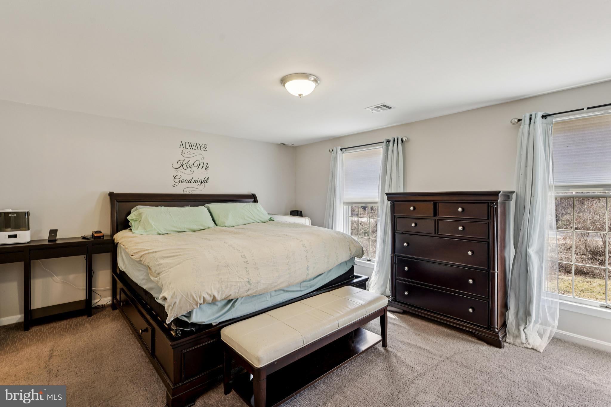 78 Rising Sun Tavern Road Millstone Township, NJ 08510 - Photo 32 of 55 a bedroom with a bed and a dresser