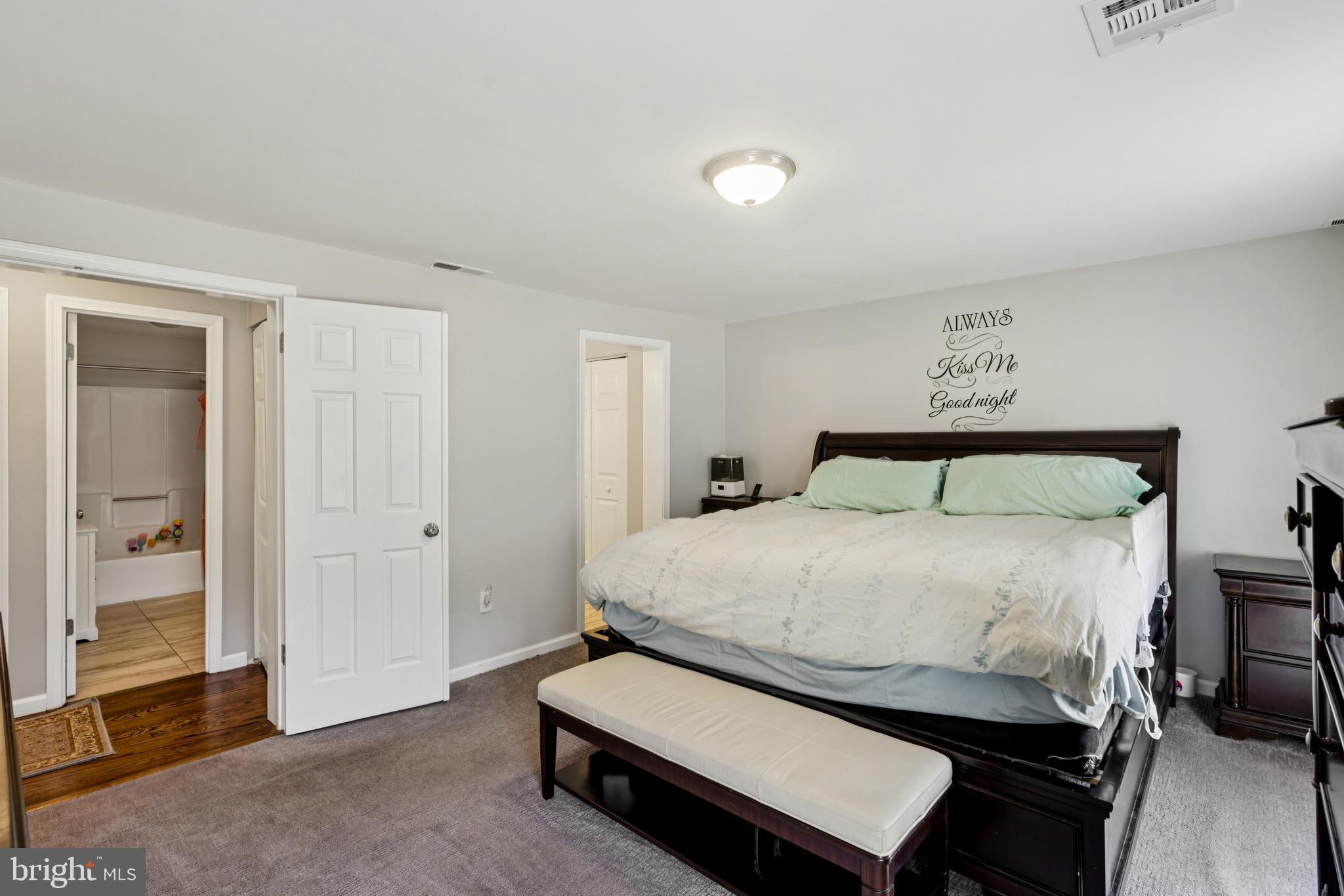 78 Rising Sun Tavern Road Millstone Township, NJ 08510 - Photo 33 of 55 a bedroom with a bed and a mirror