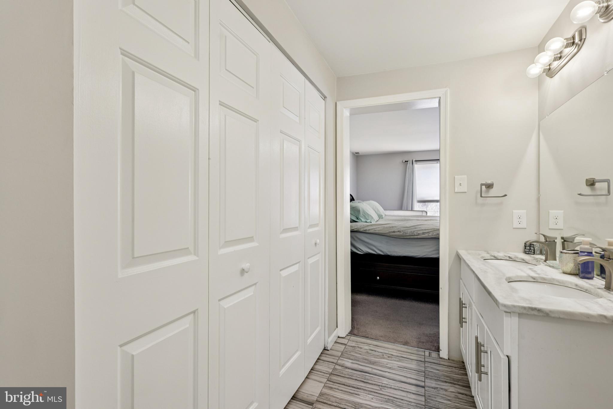 78 Rising Sun Tavern Road Millstone Township, NJ 08510 - Photo 37 of 55 a en suite bathroom with a sink and a mirror