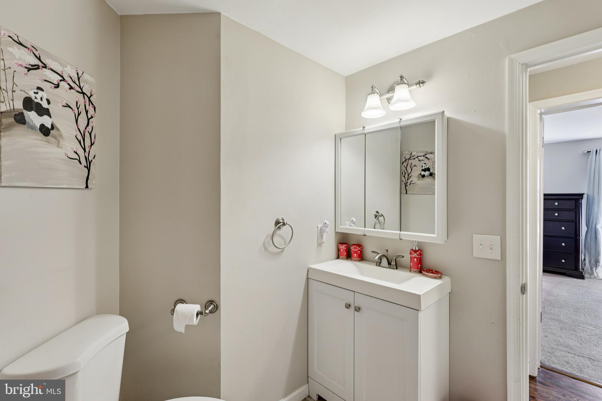 78 Rising Sun Tavern Road Millstone Township, NJ 08510 - Photo 39 of 55 a bathroom with a sink vanity mirror and toilet