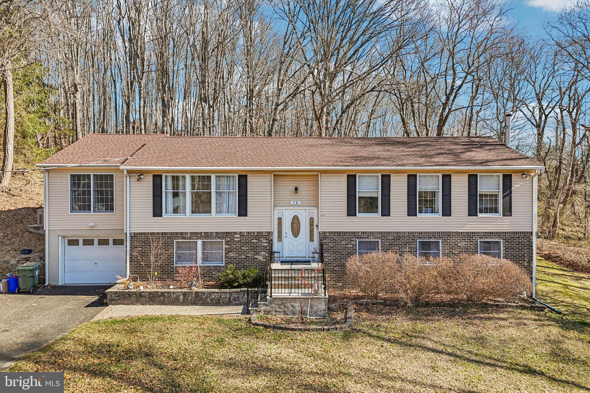 78 Rising Sun Tavern Road Millstone Township, NJ 08510 - Photo 4 of 55 a front view of a house with a yard