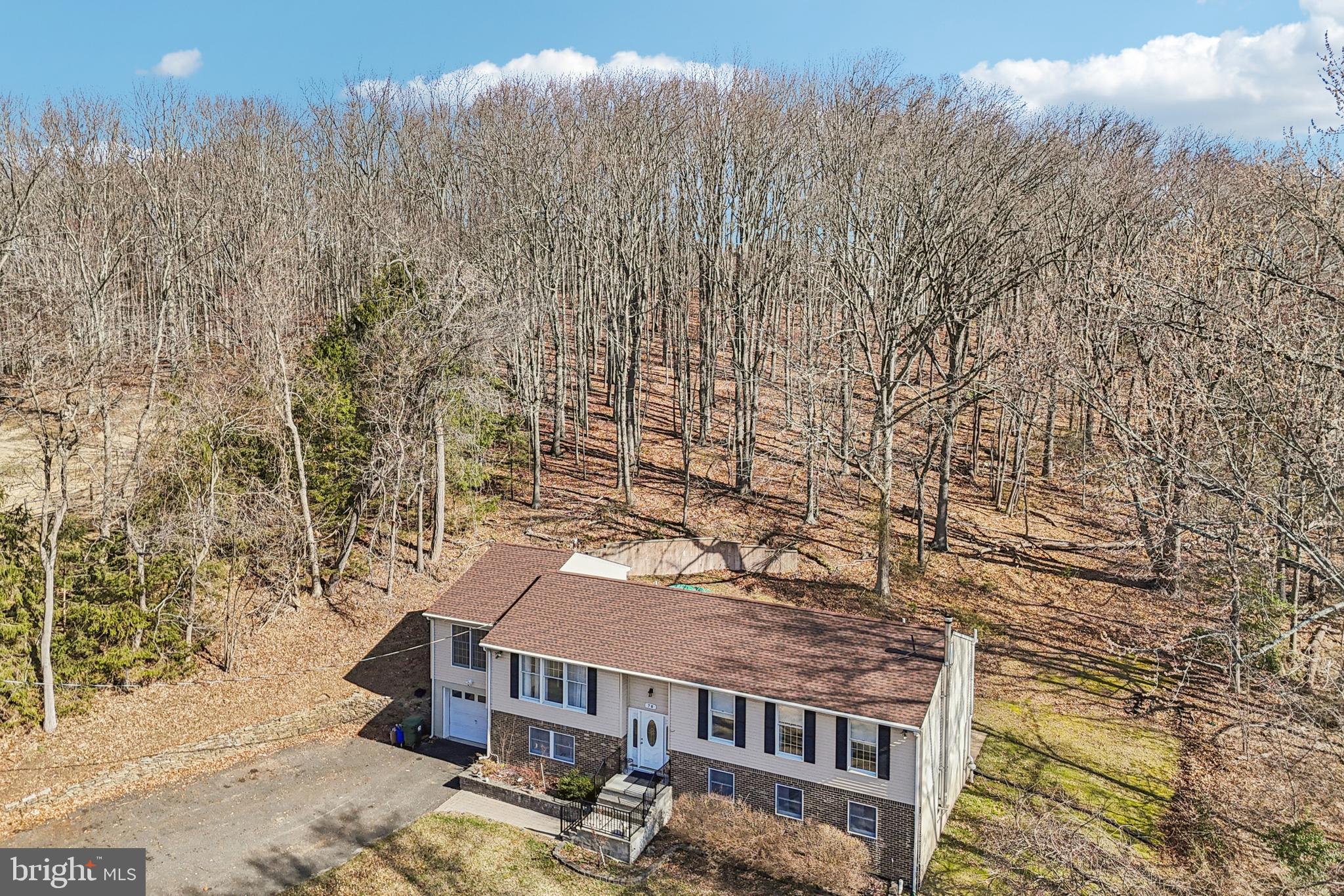 78 Rising Sun Tavern Road Millstone Township, NJ 08510 - Photo 43 of 55 a view of a house with a yard