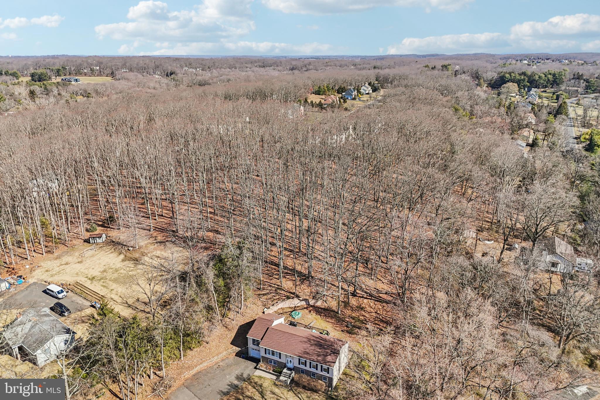 78 Rising Sun Tavern Road Millstone Township, NJ 08510 - Photo 48 of 55 an aerial view of a house with a yard