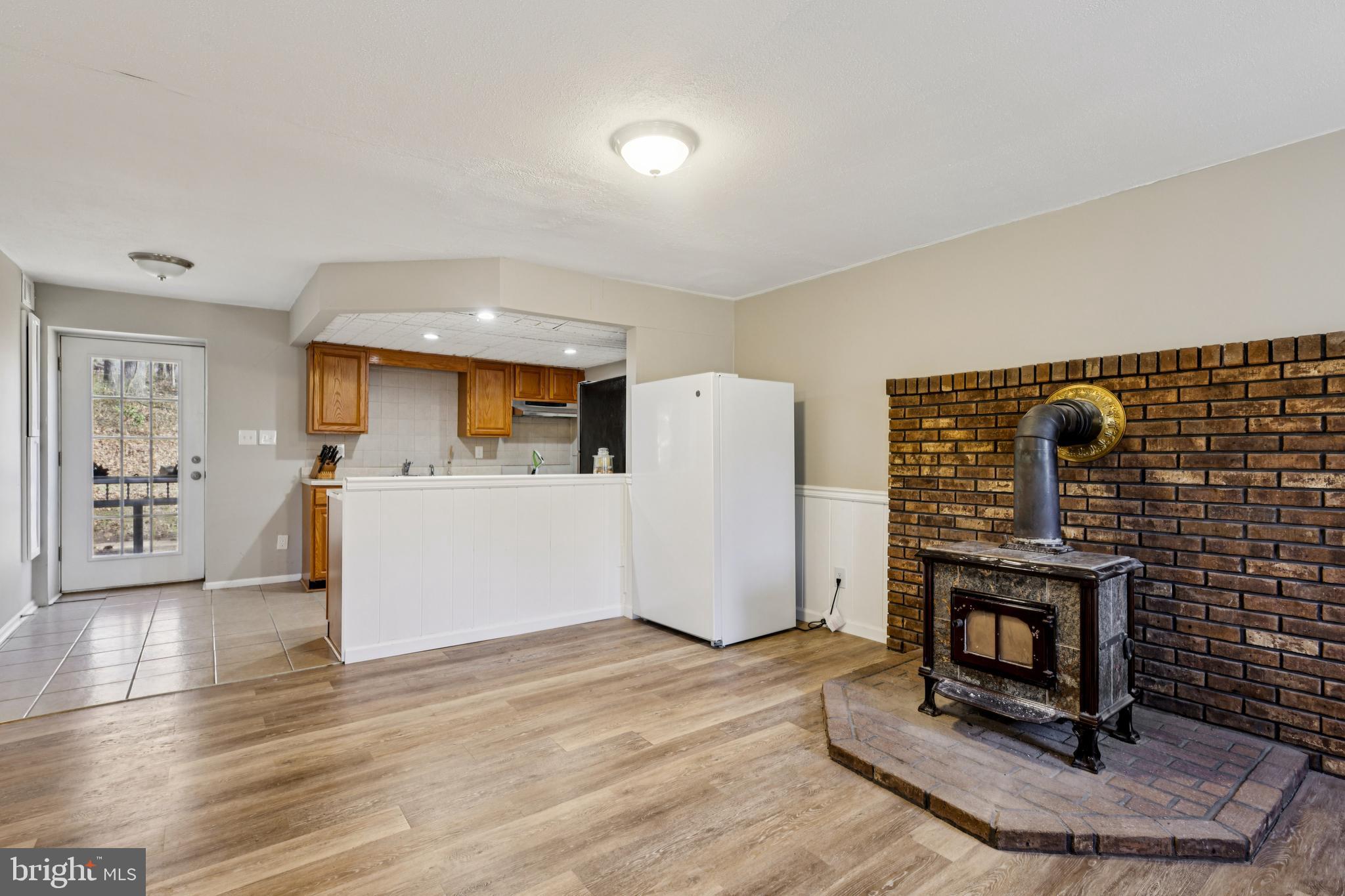 78 Rising Sun Tavern Road Millstone Township, NJ 08510 - Photo 5 of 55 a living room with furniture and a fireplace