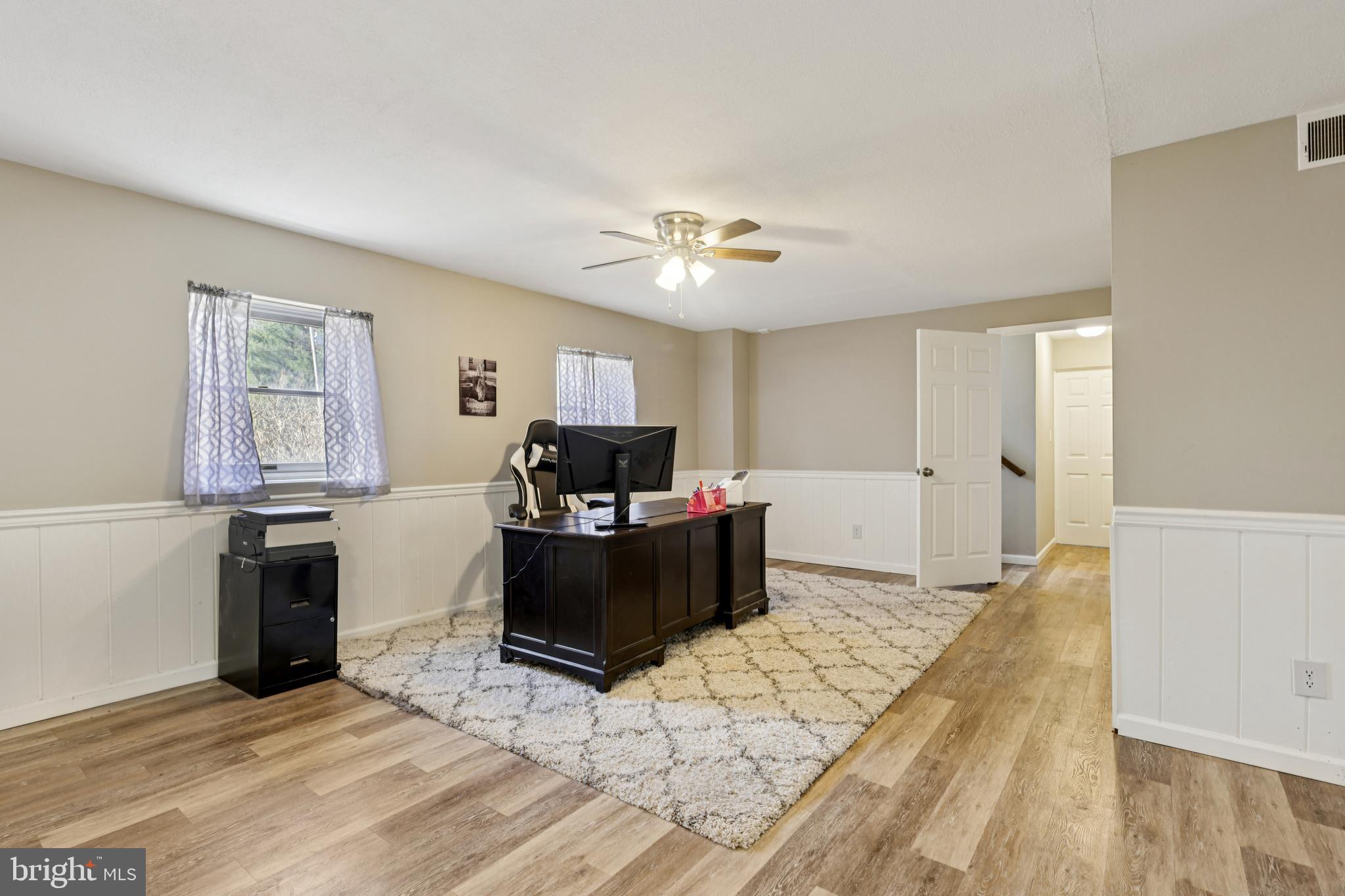 78 Rising Sun Tavern Road Millstone Township, NJ 08510 - Photo 6 of 55 a living room with furniture and a flat screen tv