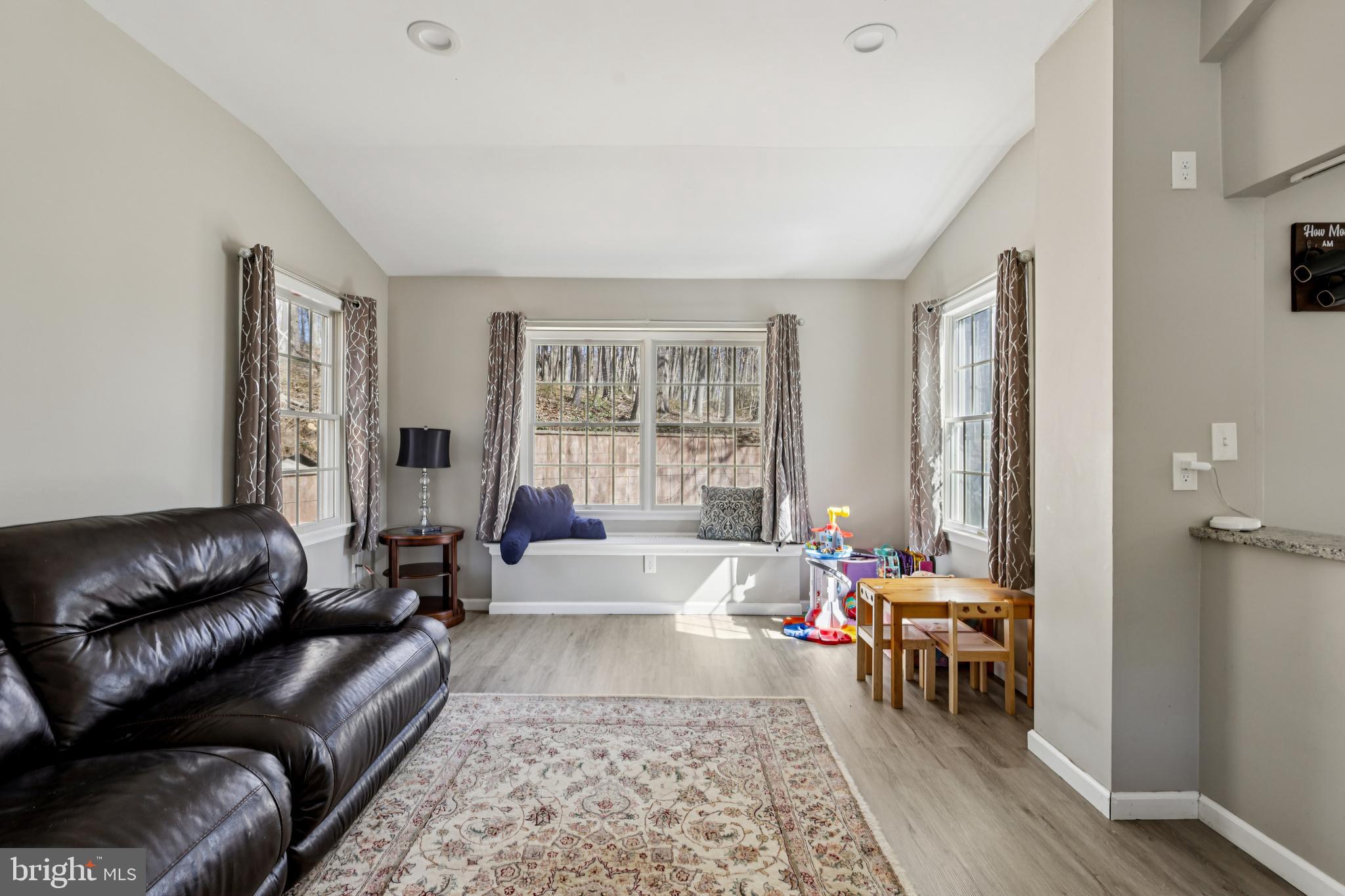 78 Rising Sun Tavern Road Millstone Township, NJ 08510 - Photo 8 of 55 a living room with furniture and a window