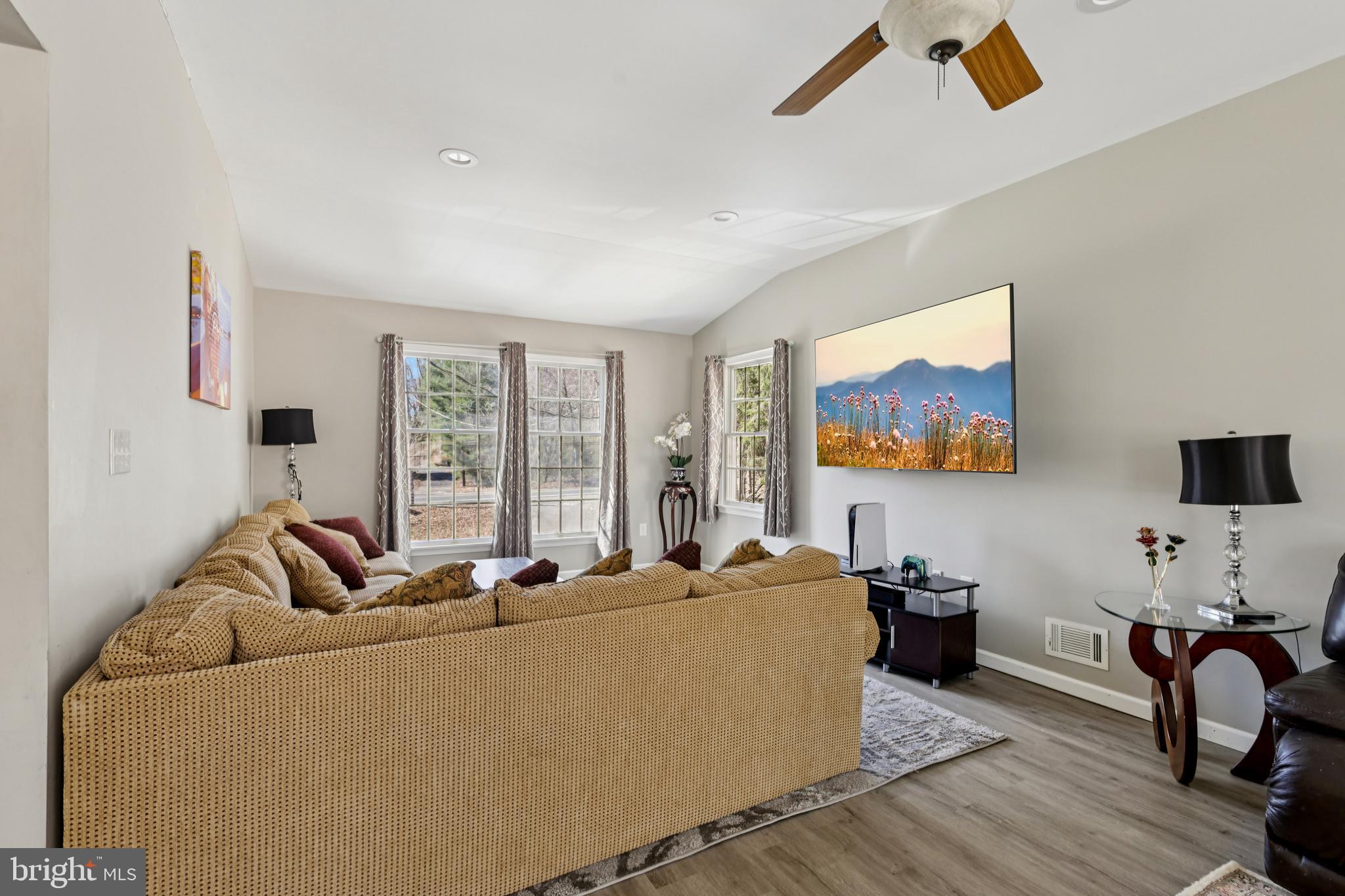 78 Rising Sun Tavern Road Millstone Township, NJ 08510 - Photo 9 of 55 a living room with furniture and a flat screen tv