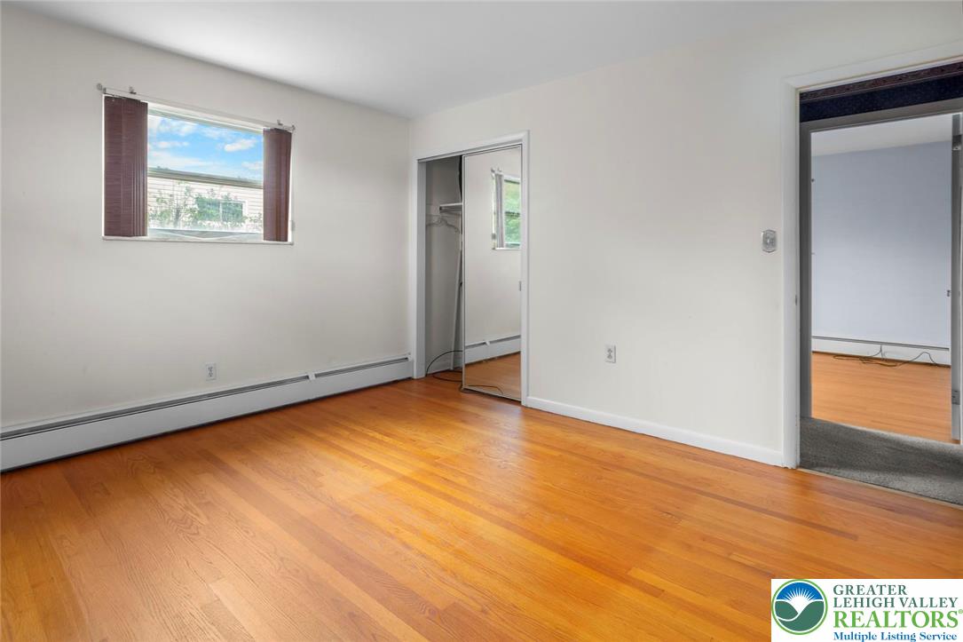 309 Georgetown Road Nazareth, PA 18064 - Photo 12 of 25 a view of an empty room with window and wooden floor