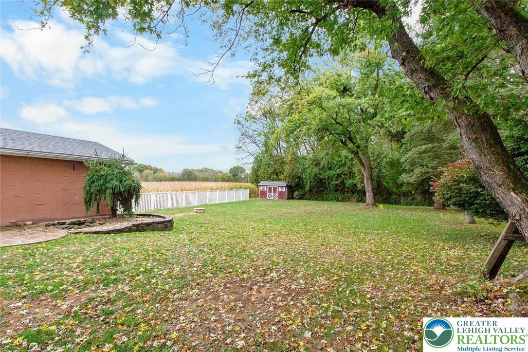 309 Georgetown Road Nazareth, PA 18064 - Photo 21 of 25 a backyard of a house with lots of green space and lake view