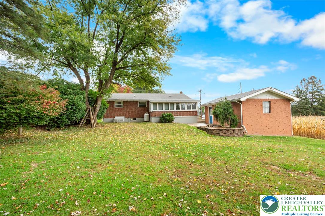 309 Georgetown Road Nazareth, PA 18064 - Photo 22 of 25 a front view of a house with a garden
