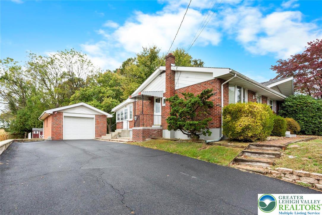 309 Georgetown Road Nazareth, PA 18064 - Photo 23 of 25 a front view of a house with a garden and yard