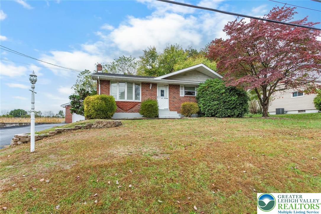 309 Georgetown Road Nazareth, PA 18064 - Photo 24 of 25 a view of a house with a yard and potted plants
