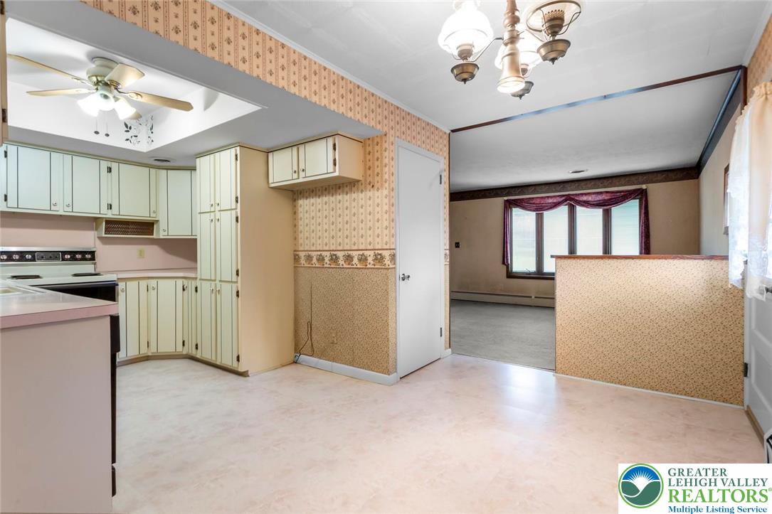 309 Georgetown Road Nazareth, PA 18064 - Photo 4 of 25 a view of a kitchen with a sink and dishwasher a refrigerator with wooden floor