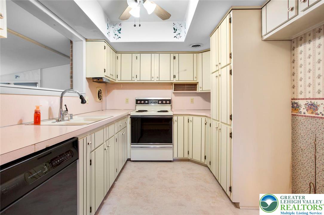 309 Georgetown Road Nazareth, PA 18064 - Photo 6 of 25 a kitchen with a stove top oven sink and a refrigerator