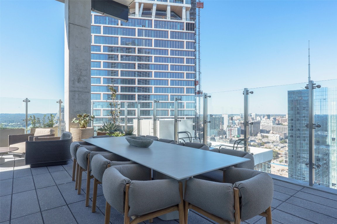 610 Davis Street, Unit 4708 Austin, TX 78701 - Photo 11 of 29 a view of a dining room with furniture and wooden floor