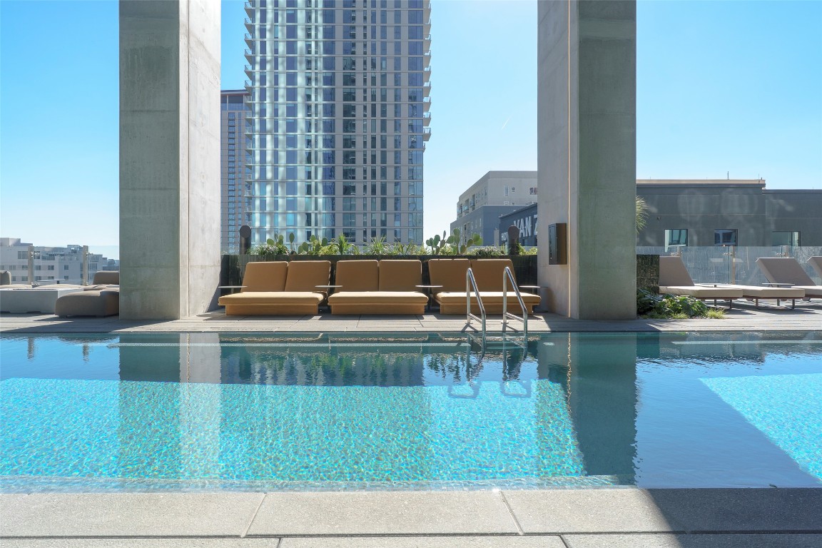 610 Davis Street, Unit 4708 Austin, TX 78701 - Photo 12 of 29 a view of kitchen with living room and furniture