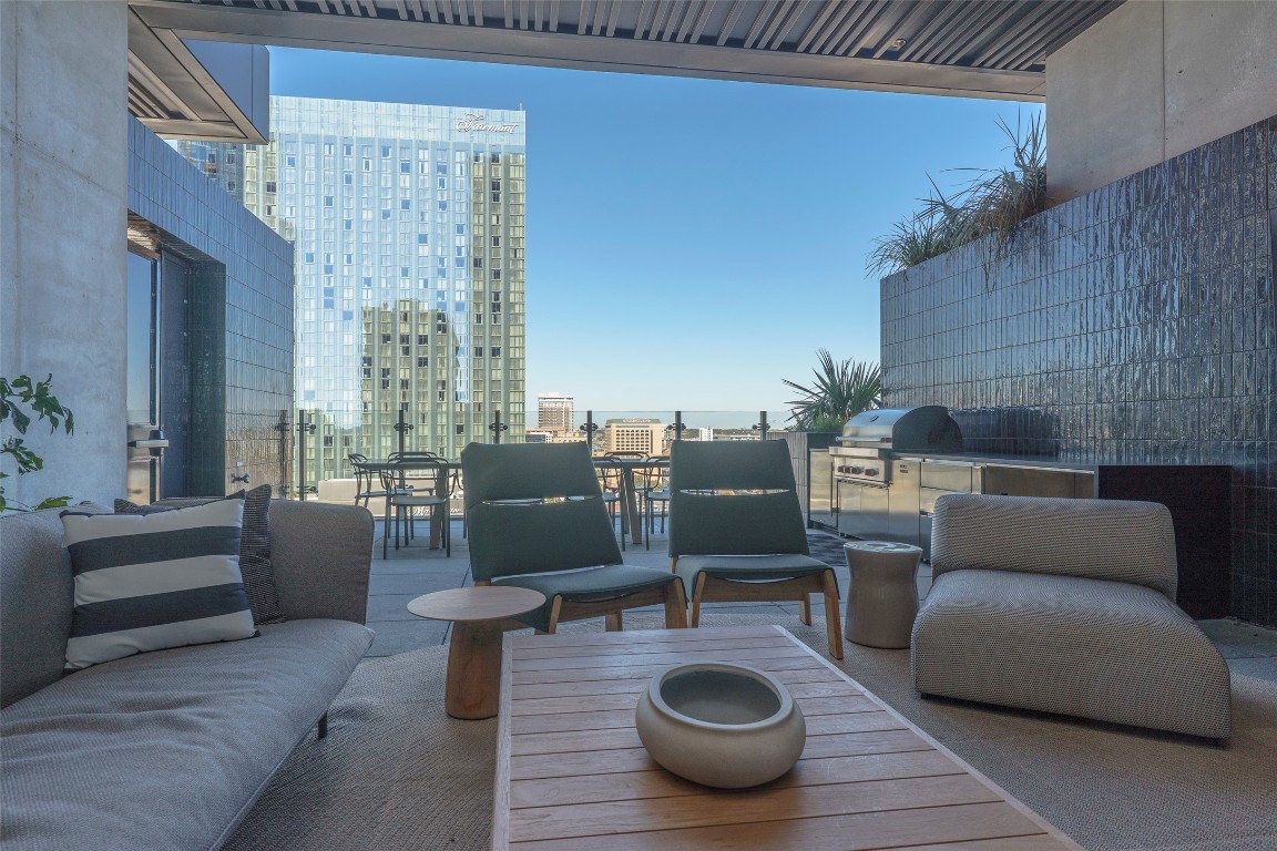 610 Davis Street, Unit 4708 Austin, TX 78701 - Photo 16 of 29 a living room with furniture a rug and a potted plant