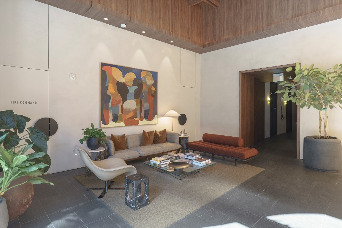 610 Davis Street, Unit 4708 Austin, TX 78701 - Photo 18 of 29 a living room with furniture and flowers