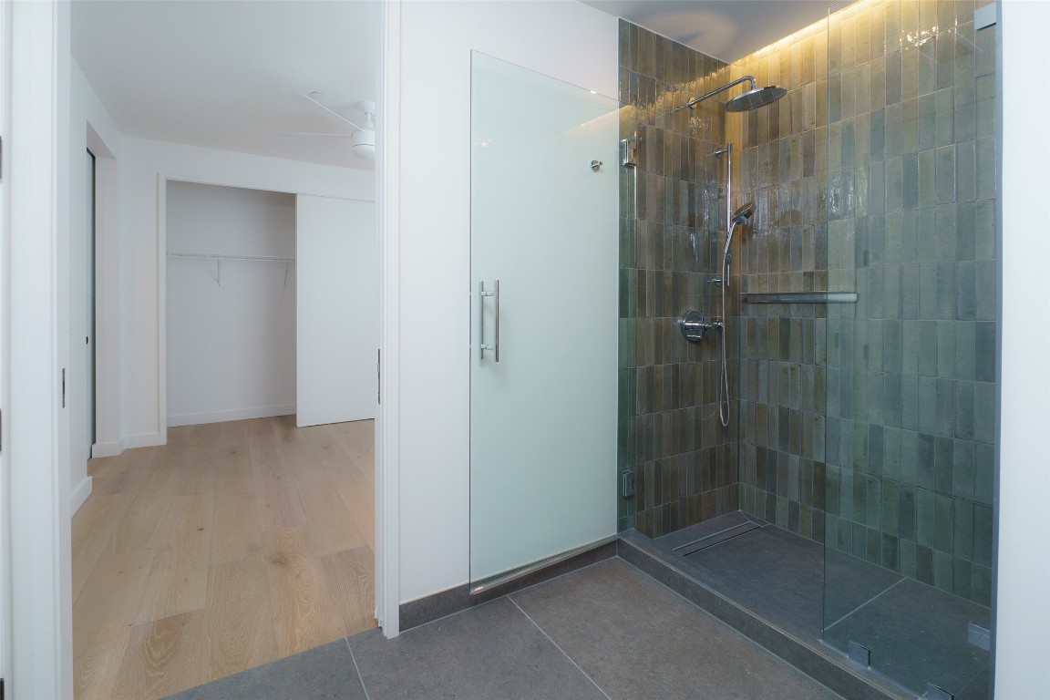 610 Davis Street, Unit 4708 Austin, TX 78701 - Photo 24 of 29 a bathroom with a glass shower door