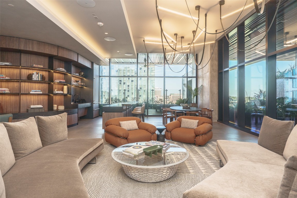 610 Davis Street, Unit 4708 Austin, TX 78701 - Photo 9 of 29 a living room with furniture and a large window