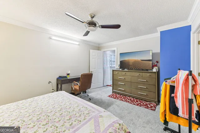 a bedroom with a bed and furniture