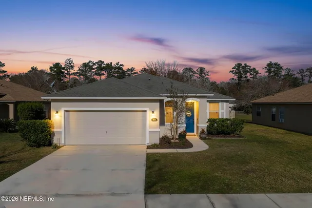 front view of a house with a yard