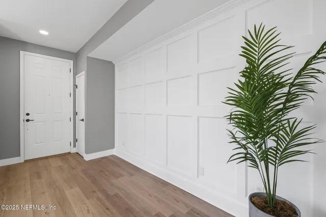 a kitchen with stainless steel appliances granite countertop a refrigerator stove and wooden cabinets