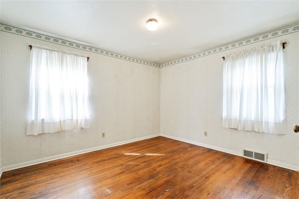 1268 Old State Road Apollo, PA 15613 - Photo 12 of 22 a view of an empty room with wooden floor and a window