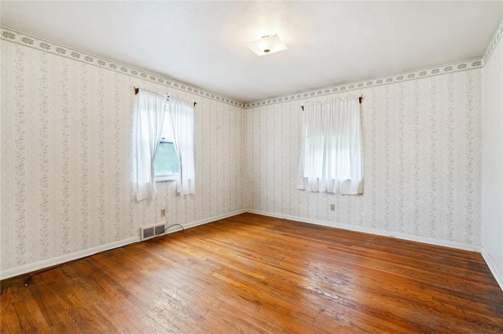 1268 Old State Road Apollo, PA 15613 - Photo 14 of 22 a view of an empty room with wooden floor and a window
