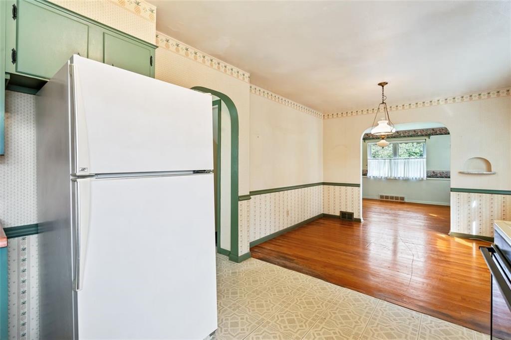 1268 Old State Road Apollo, PA 15613 - Photo 20 of 22 a kitchen with stainless steel appliances a refrigerator and wooden floor